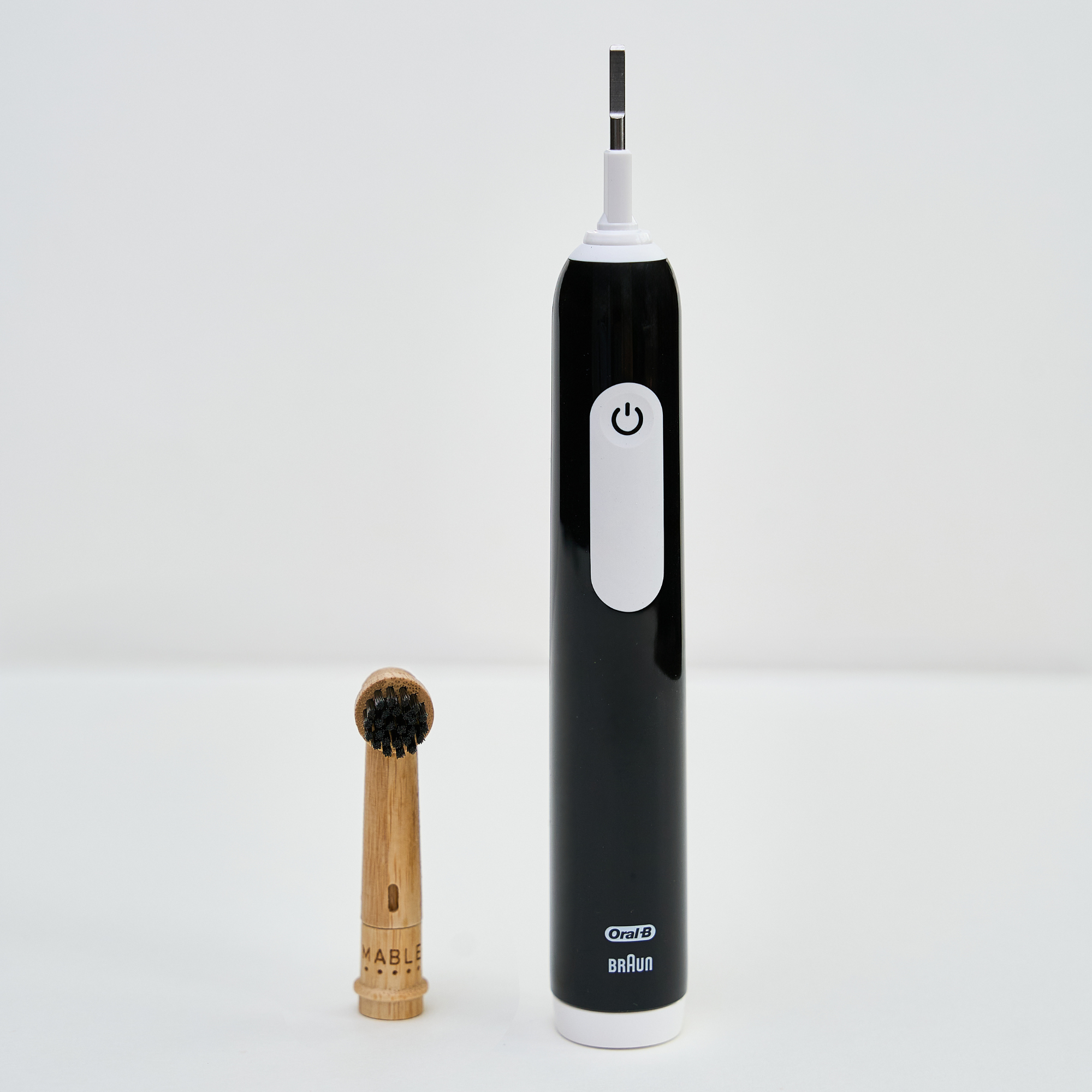 MABLE bamboo toothbrush head for Oral-B on a light grey background