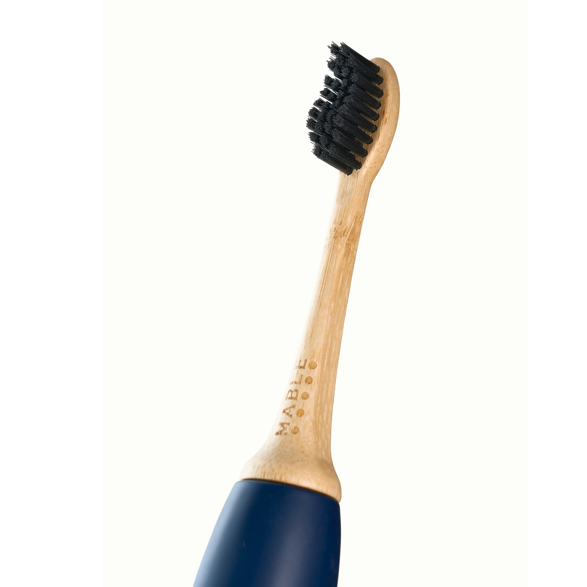 MABLE bamboo toothbrush head with black bristles connected to a Sonicare blue handle on a white background