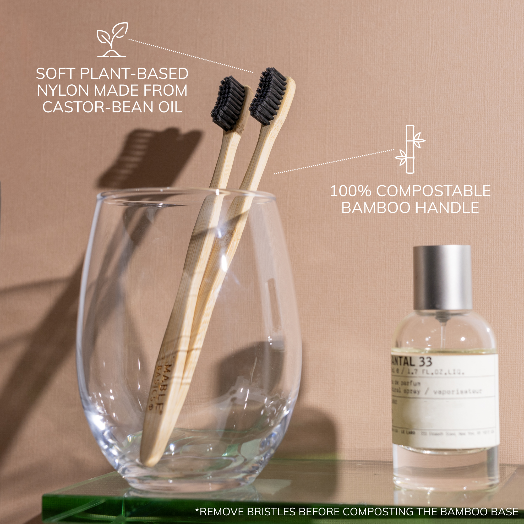 MABLE Basics, MABLE bamboo Toothbrush with castor oil bristles and a compostable bamboo base, plastic toothbrush alternative, affordable bamboo toothbrush, bamboo toothbrushes on a tan backdrop in a bathroom setting