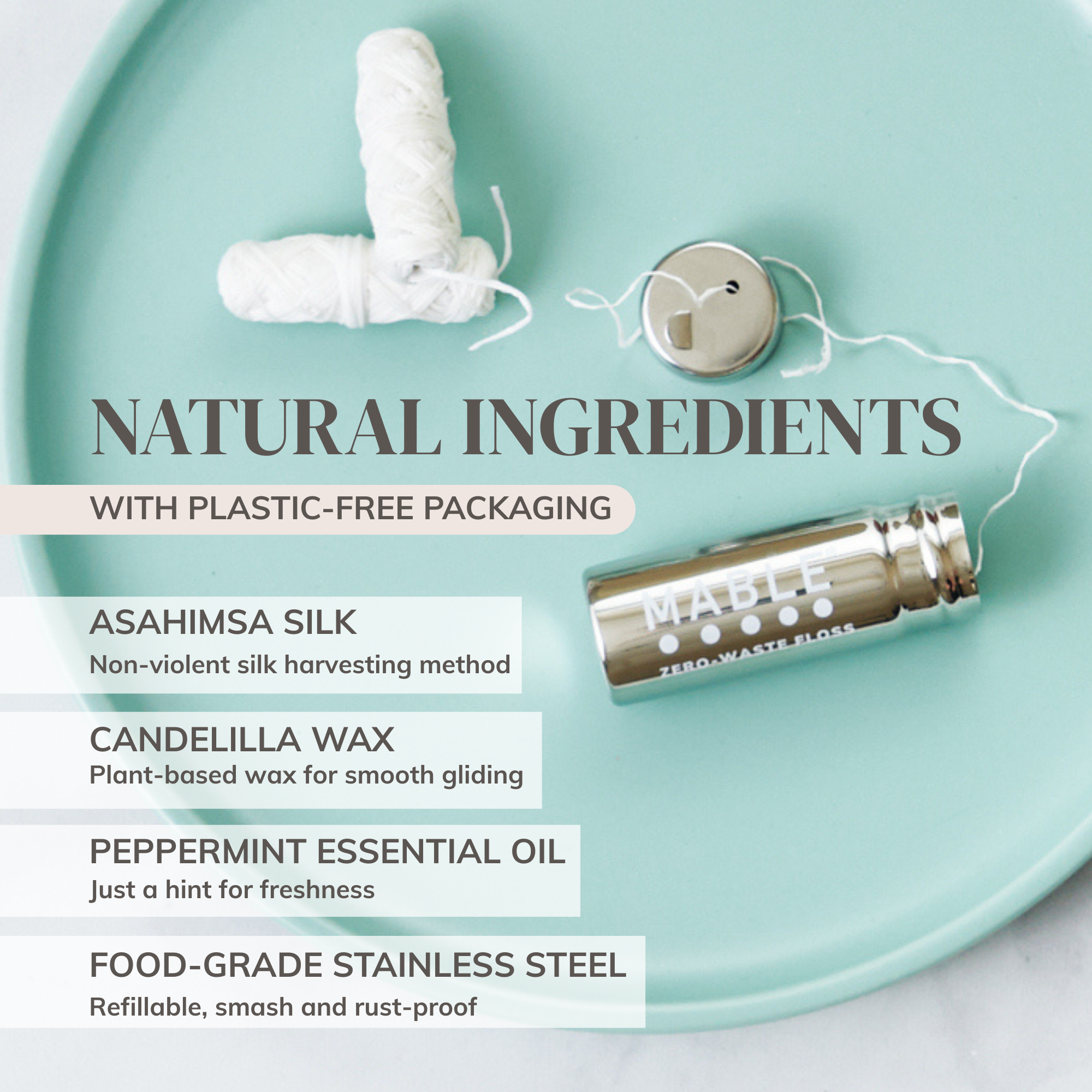 MABLE silk dental floss in a refillable container with natural ingredients and plastic-free packaging on a light blue plate.