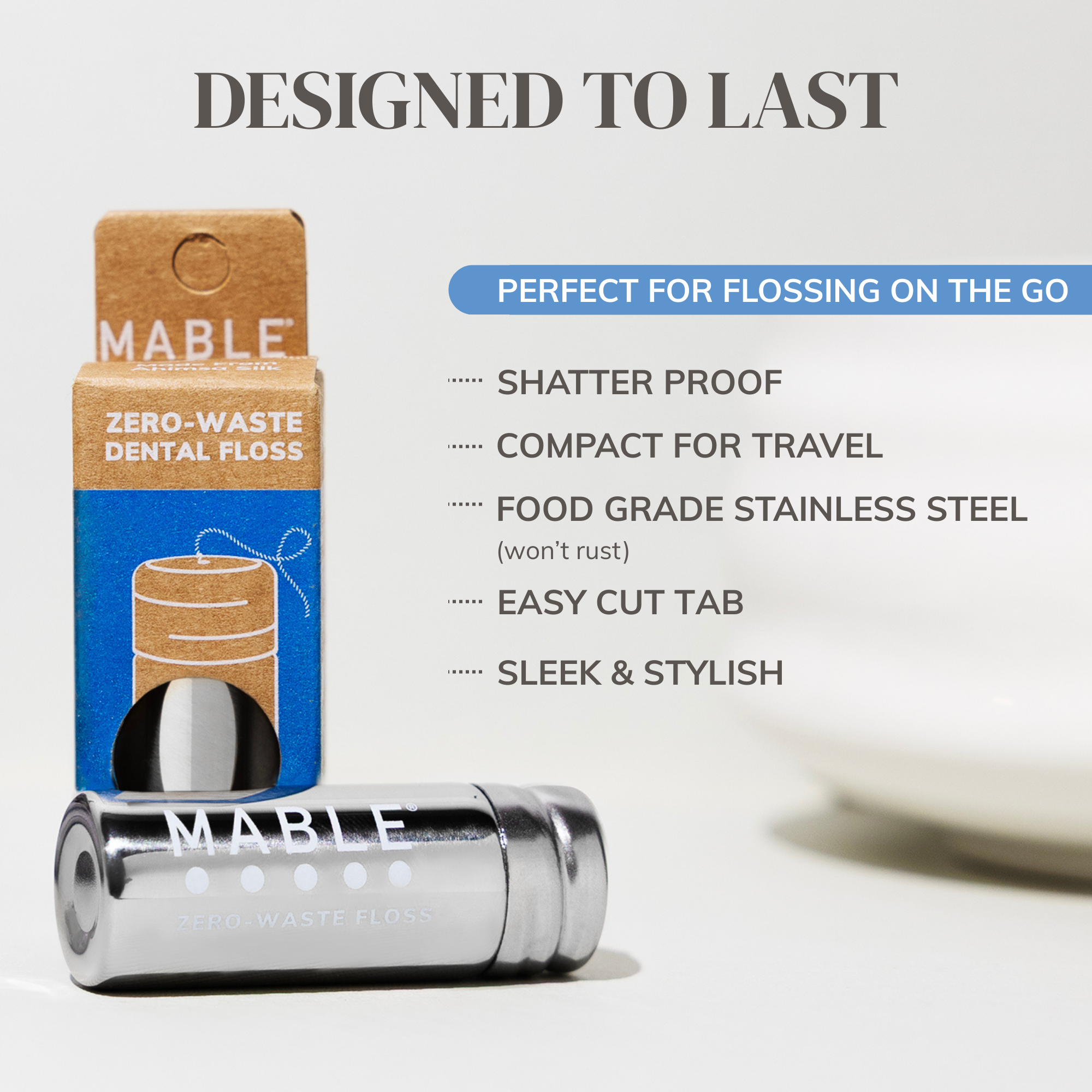 MABLE zero-waste dental floss packaging with product and features listed on a light gray background. Designed to last with shatter proof stainless steel, an easy cut tab and a sleek and stylish design