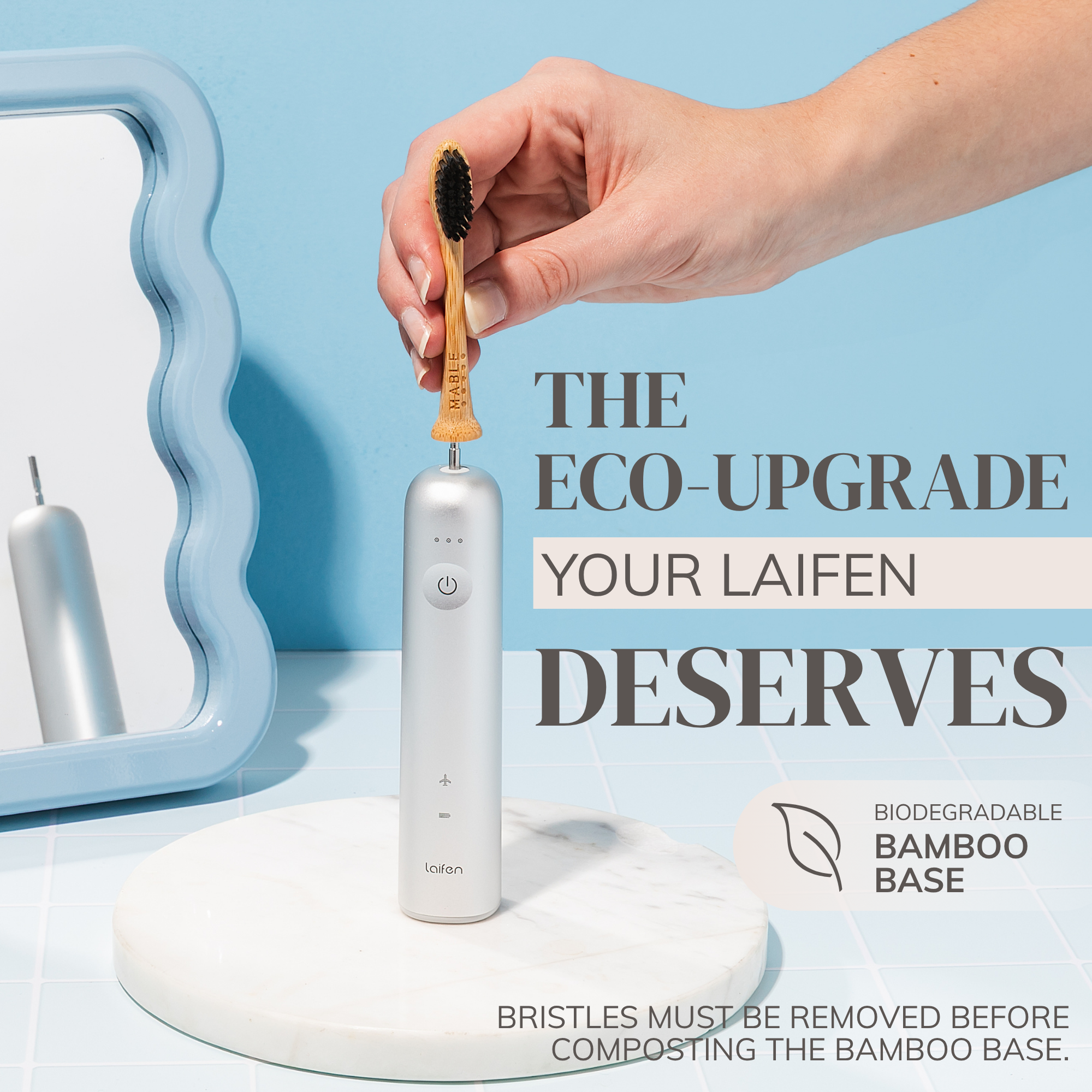 Hand holding a MABLE bamboo toothbrush head with a Laifen electric toothbrush and text about eco-upgrade and biodegradable bamboo base. Bristles should be removed before composting the head