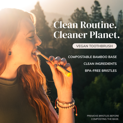 Woman using a MABE bamboo toothbrush with a forest backdrop at sunset with text saying clean routine cleaner planet, vegan toothbrush, compostable bamboo base, clean ingredients, BPA-free bristes