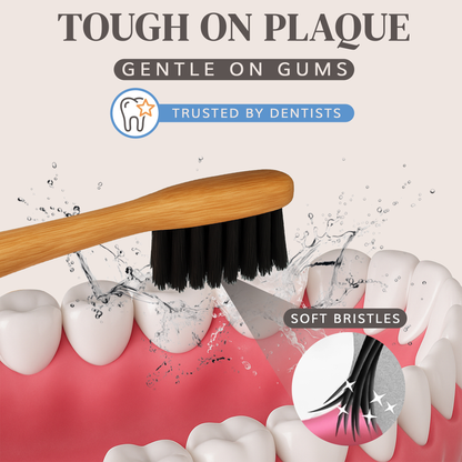 MABLE Wooden toothbrush with black charcoal infused bristles cleaning teeth, emphasizing soft bristles and dental trust.