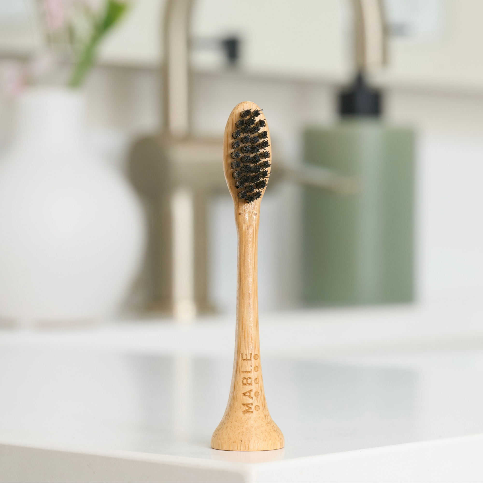 MABLE Bamboo electric head compatible with Philips Sonicare models on a blurred neutral bathroom background