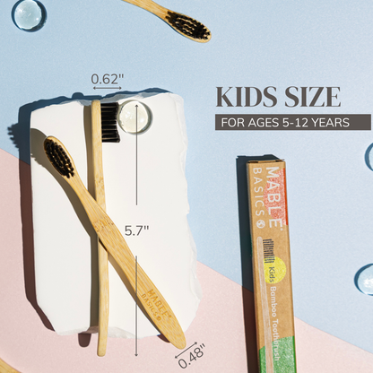 MABLE Children's bamboo toothbrush with measurements and product packaging on a colorful background