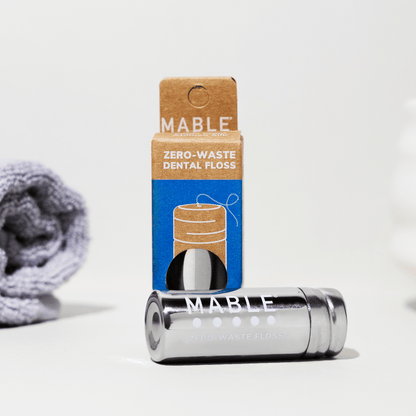 MABLE refillable dental floss in eco-friendly zero-waste container filled with compostable silk dental floss
