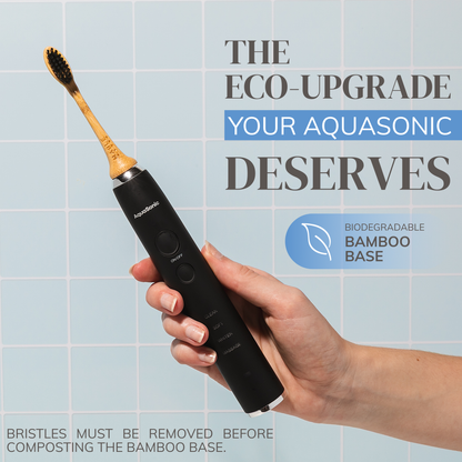 MABLE eco friendly bamboo electric toothbrush head for Aquasonic models, womans hand holding the wave toothbrush with sustainable head 