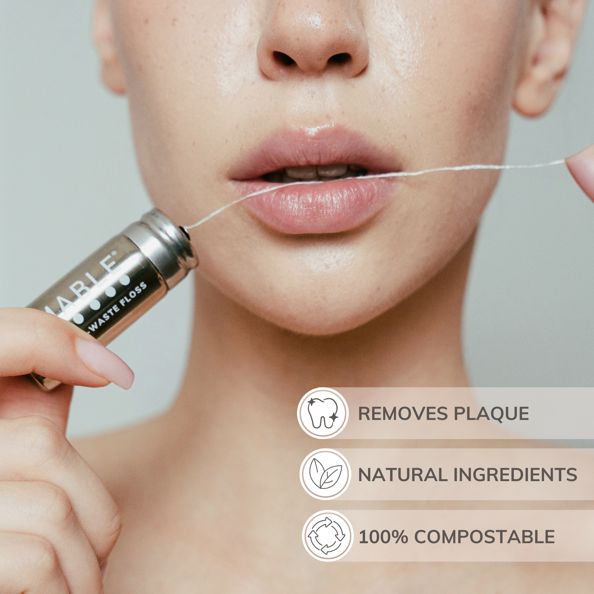 MABLE silk dental floss container held by a woman and compostable floss between her lips with features like removes plaque, natural ingredients, 100% biodegradable